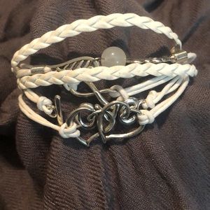 NWT Faux white leather cord & silver “love” bracelet. 7” with 2” extender.